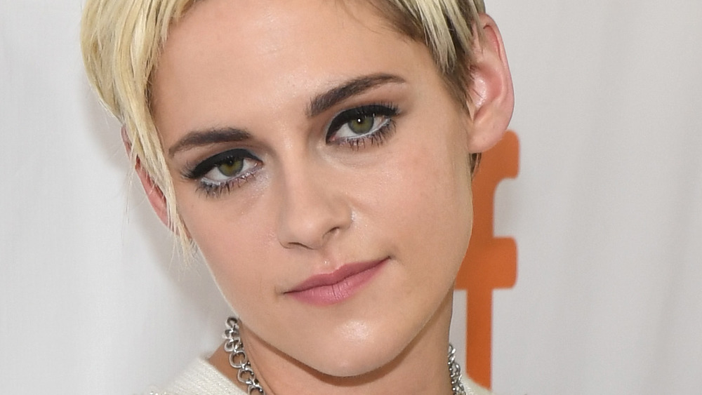 Kristen Stewart gives a slight smile for the cameras on the red carpet