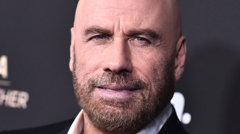 John Travolta smiles on the red carpet