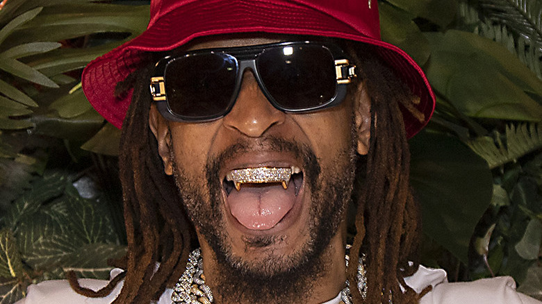 Lil Jon red hat diamond grillz gold fangs