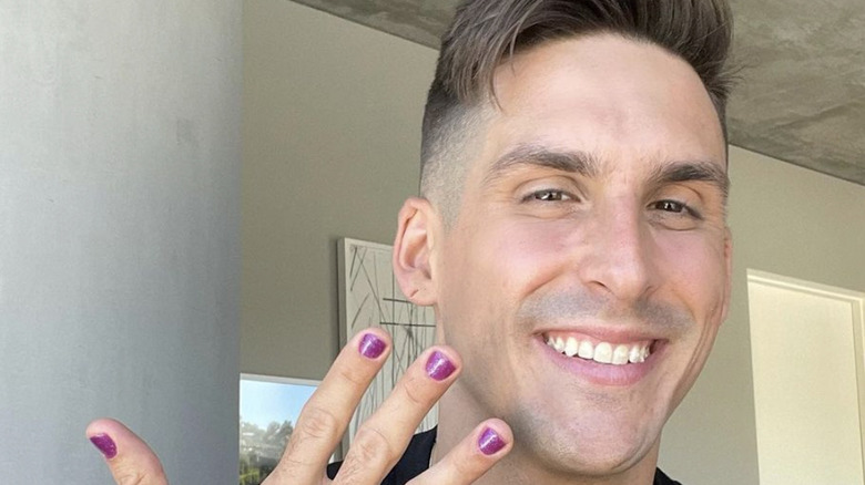Cody Rigsby smiling with manicure