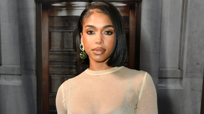 Lori Harvey posing at an event