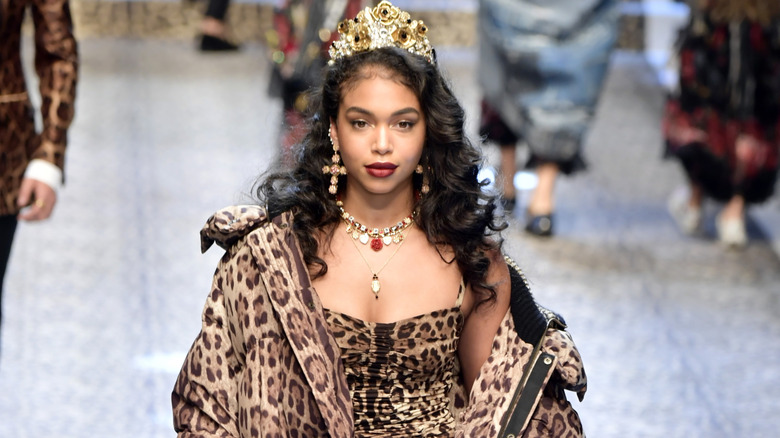 Lori Harvey walking on a runway as a model