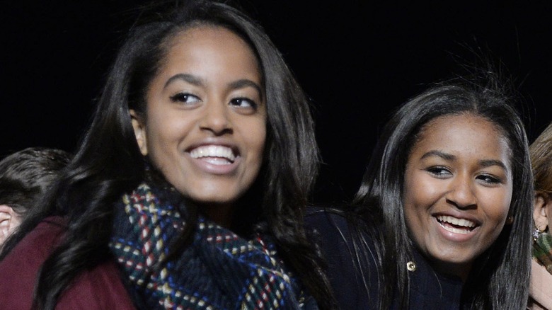 Sasha and Malia Obama smiling for a picture