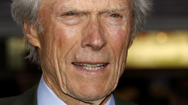 Clint Eastwood staring and smiling slightly