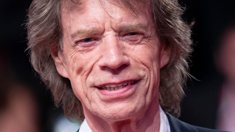 Mick Jagger on the red carpet smiling