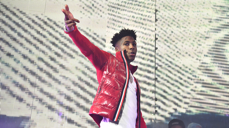 NBA Youngboy wearing red puffer jacket