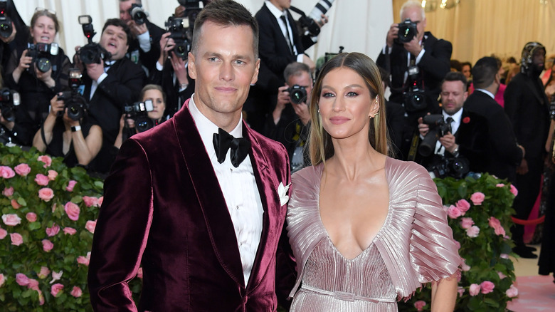 Tom Brady and Gisele Bundchen standing together