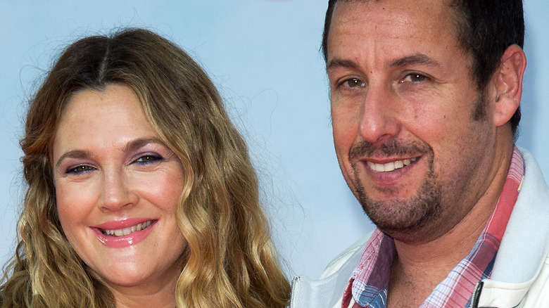 Drew Barrymore and Adam Sandler smiling together