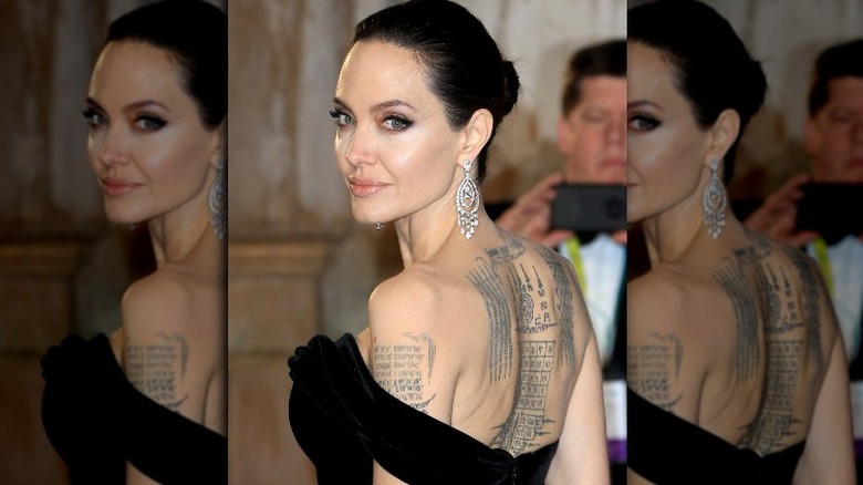 Angelina Jolie with her tattoos 