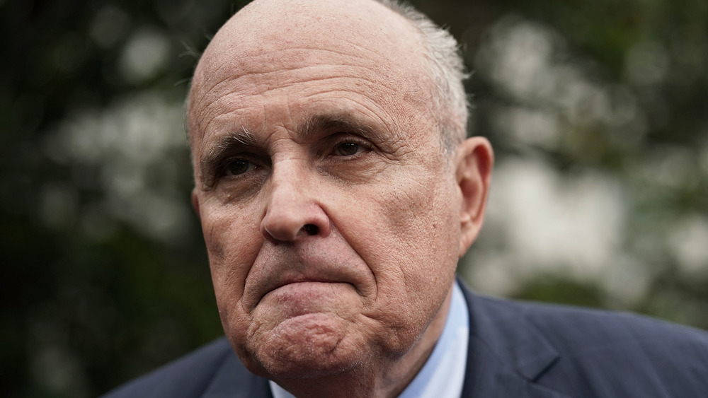 Rudy Giuliani prepares to talk to the press in 2020