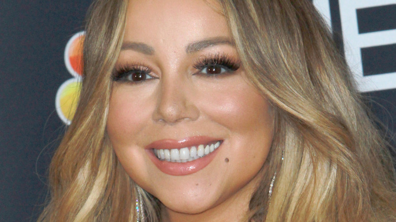 Mariah Carey smiles on the red carpet