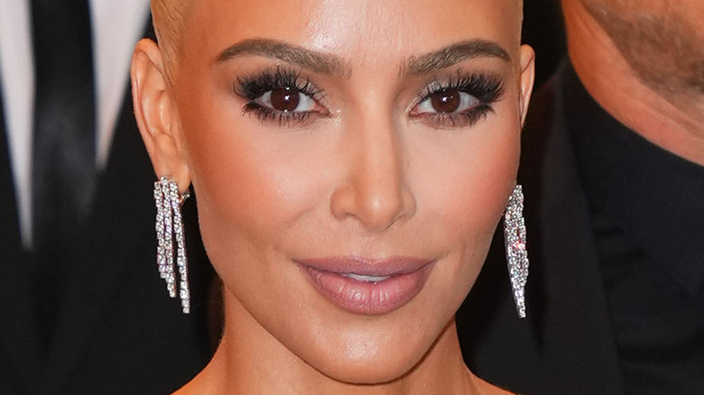 Kim Kardashian with long diamond earrings