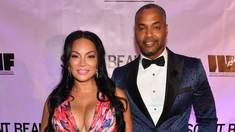 Egypt Sherrod and Mike Jackson posing together at an event.