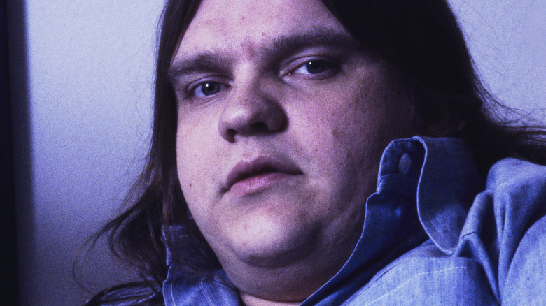 Meat Loaf looking sideways blue denim shirt