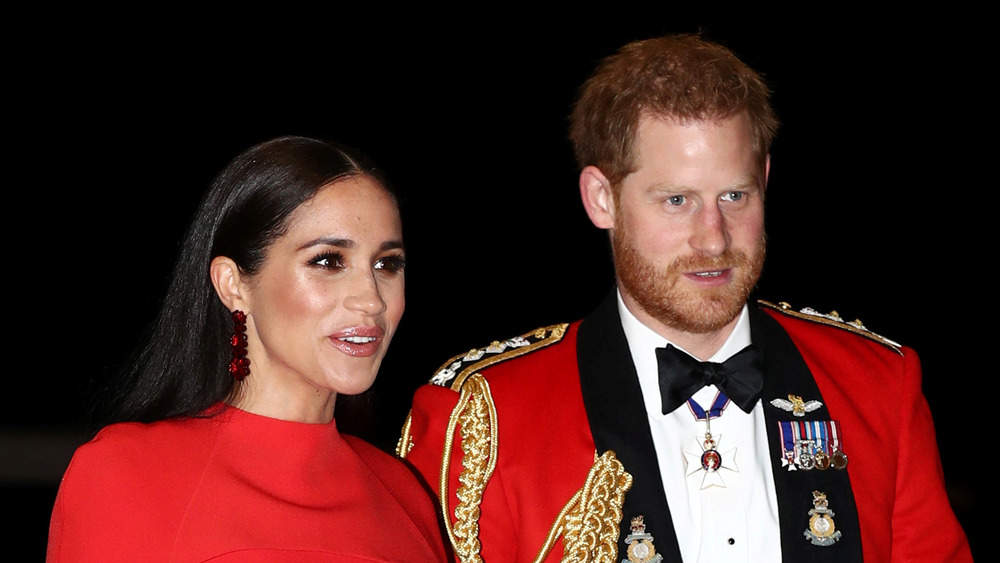 Prince Harry and Meghan Markle in red