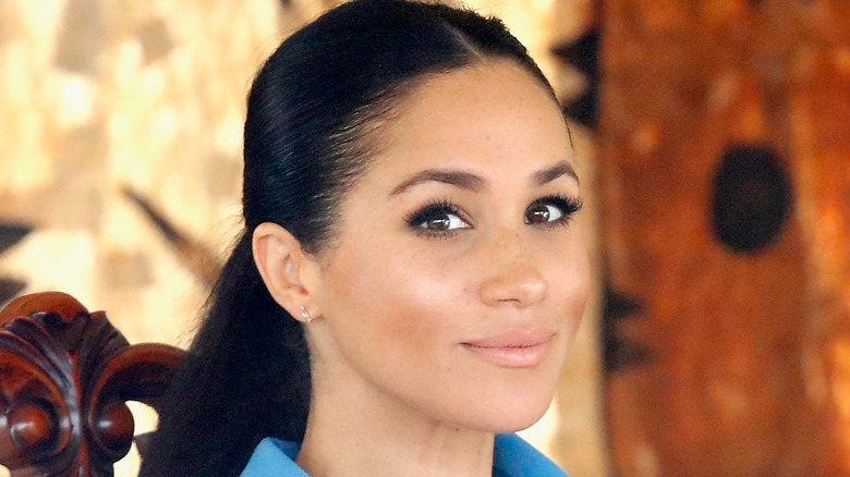 Meghan Markle smirking
