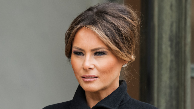 Melania Trump in black coat