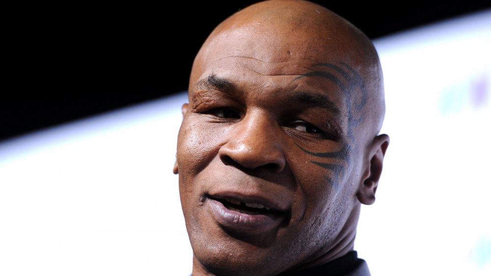 Mike Tyson close up, face tattoo on display
