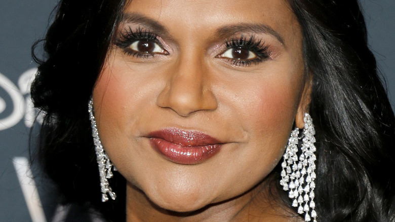 Mindy Kaling poses in intricate earrings