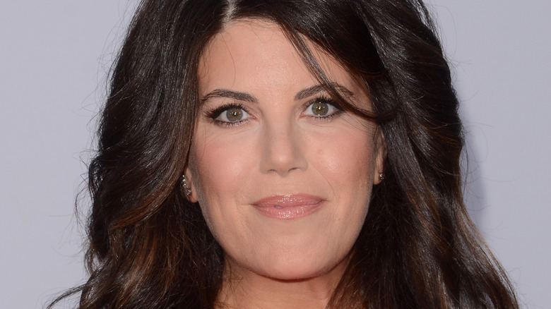 Monica Lewinsky gives a slight smile on the red carpet