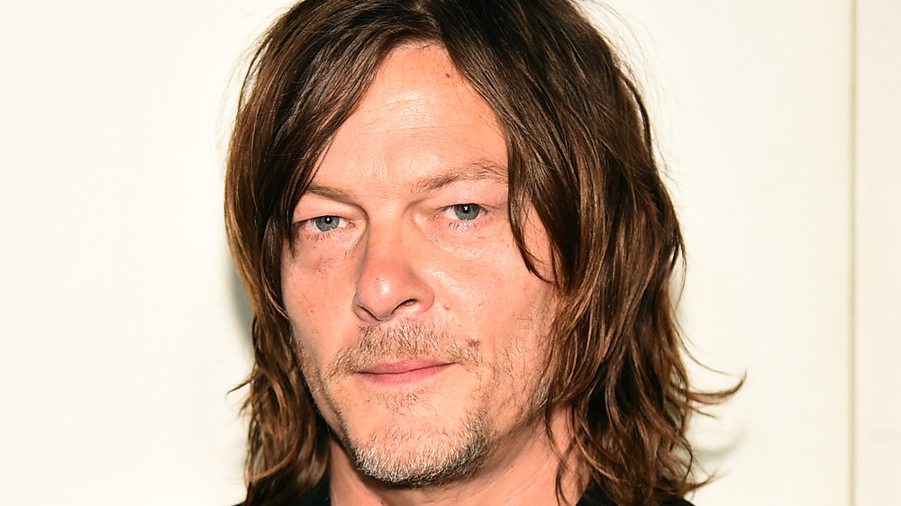 Norman Reedus smirking