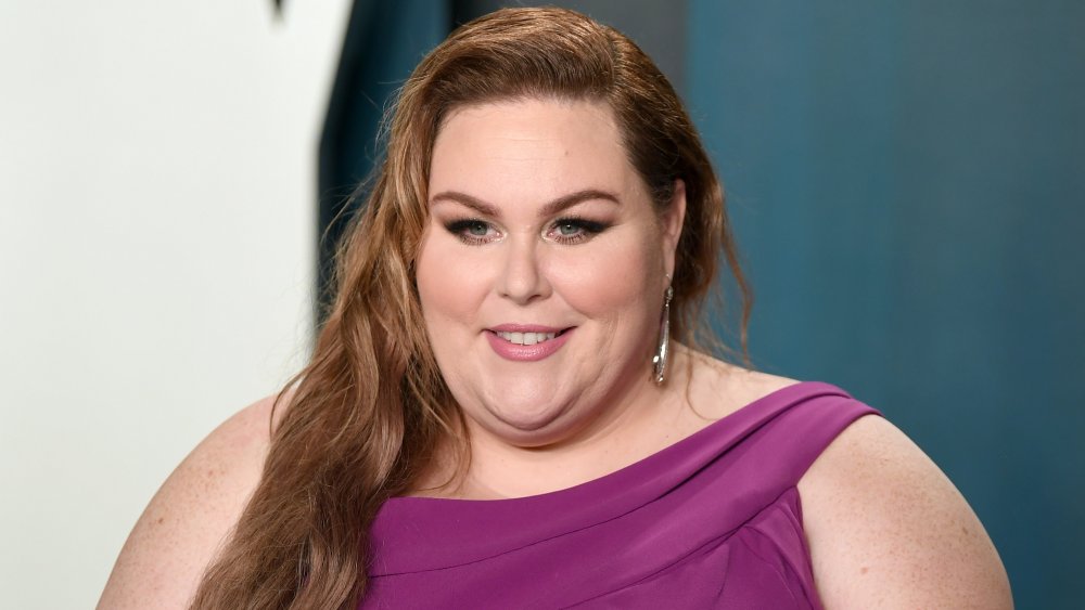 Chrissy Metz in a purple dress, smiling at the 2020 Vanity Fair Oscar Party