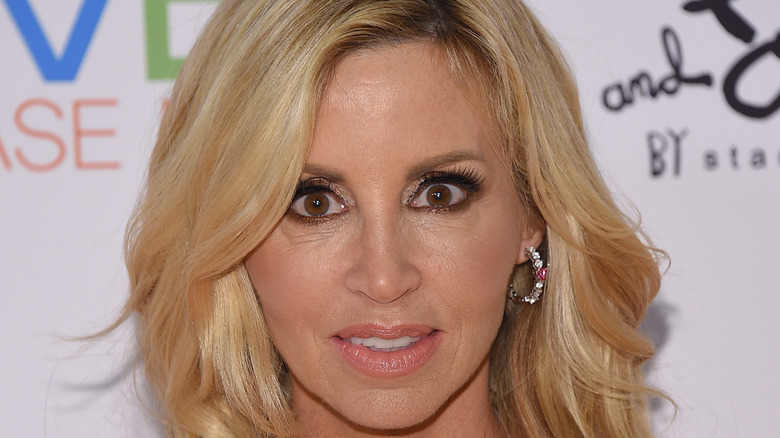 Camille Grammer stares into the camera on the red carpet