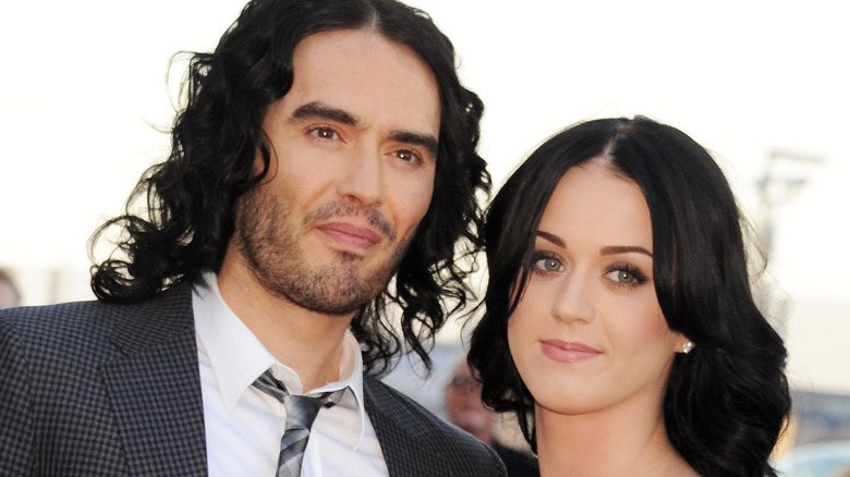 Katy Perry and Russell Brand posing