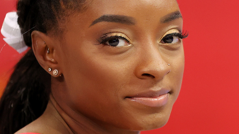 Simone Biles smiling at a competition