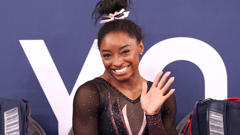 Simone Biles smiling at a competition
