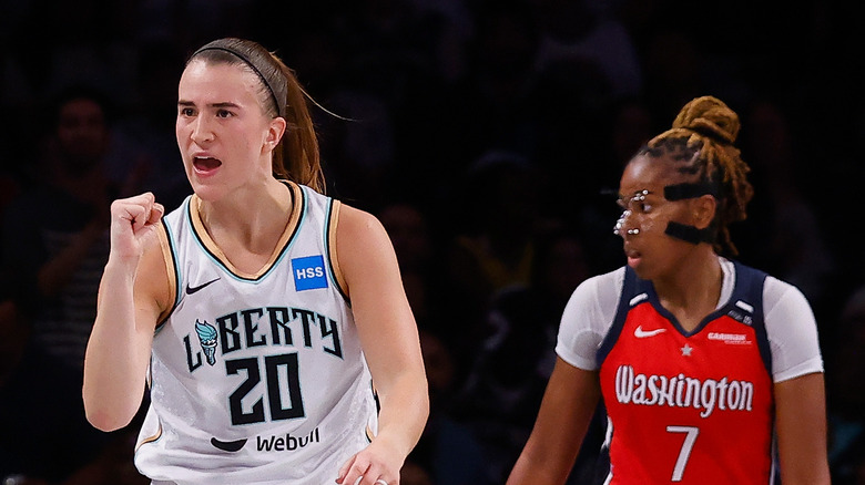 Sabrina Ionescu celebrates during a game