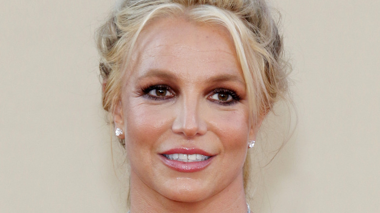 Britney Spears smiling and looking to the side