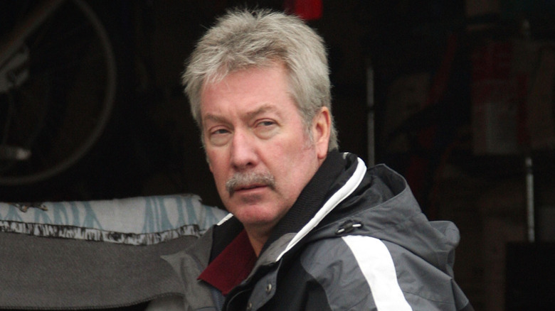 Drew Peterson in front of his garage
