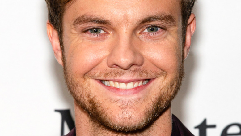 Jack Quaid smiling