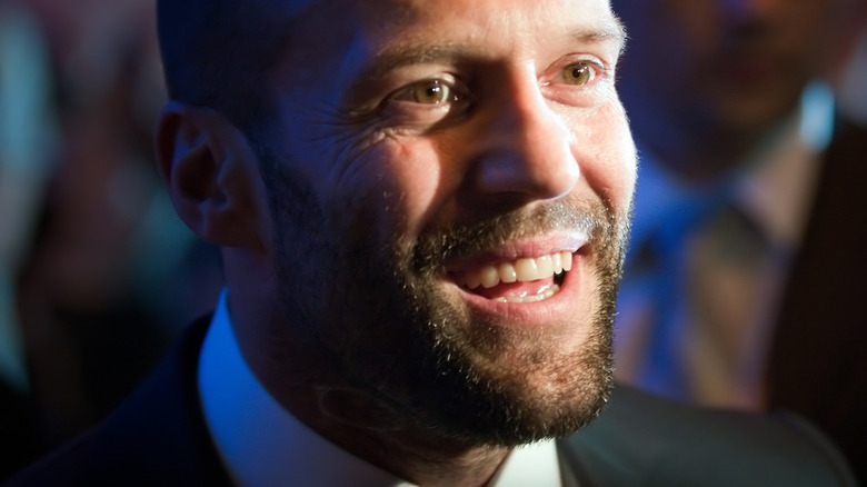 Jason Statham grinning