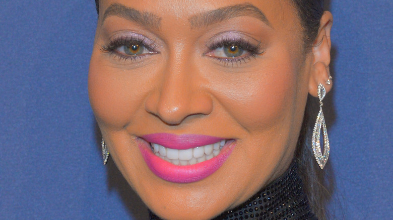 La La Anthony smiles on the red carpet