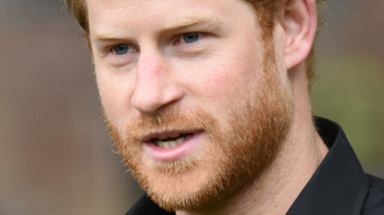 Prince Harry with a neutral expression