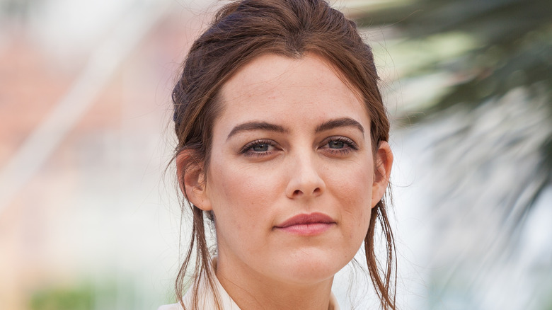Riley Keough smiling slightly