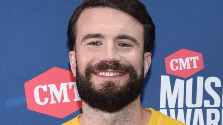 Sam Hunt smiling at an event