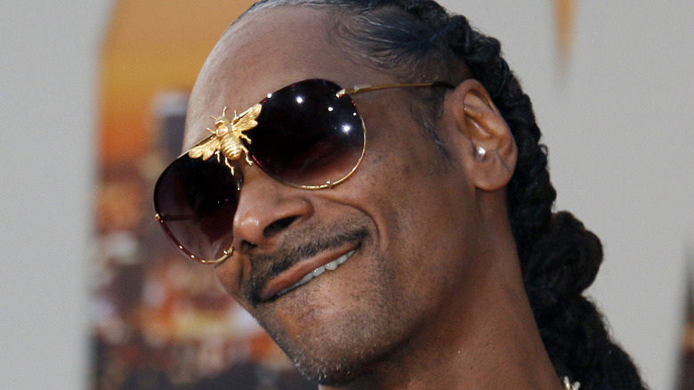Snoop Dogg smiling with sunglasses 