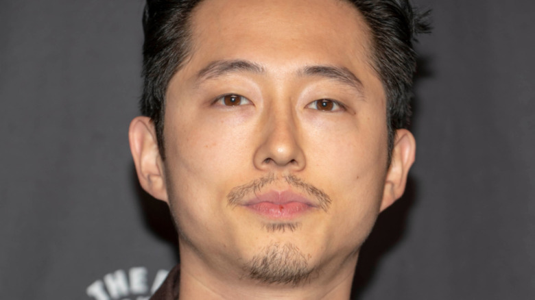 Steven Yeun posing