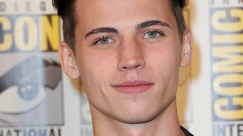 Tanner Buchanan, smiling, shaven face, brown hair, red carpet in 2019