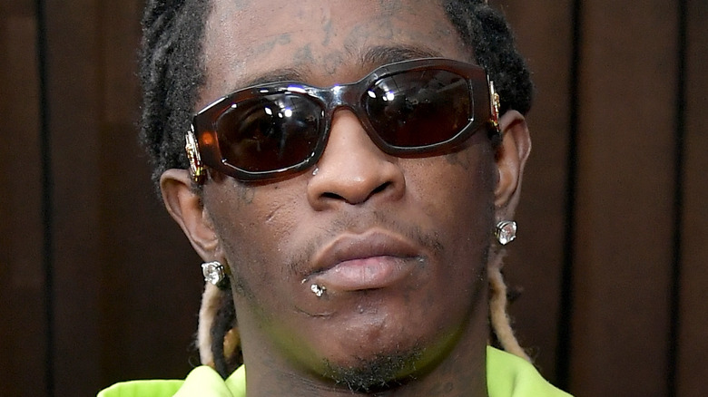 Young Thug wearing Sunglasses