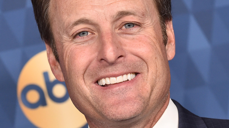 Chris Harrison smiling on the red carpet