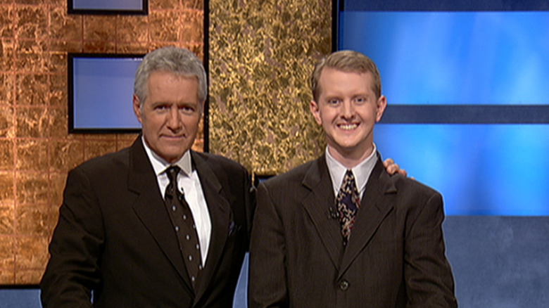 Ken Jennings and Alex Trebek smile 