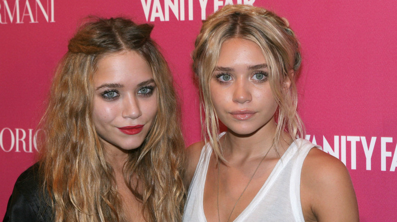 Mary-Kate and Ashley Olsen posing 