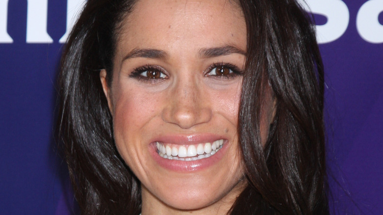 Meghan Markle smiles into camera