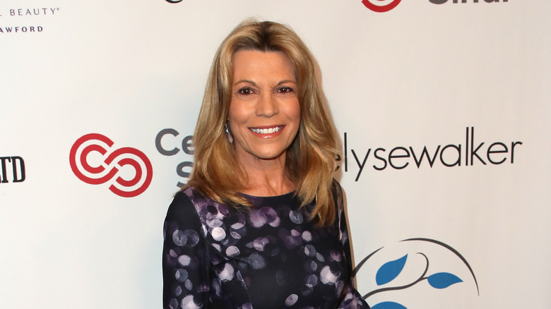 Vanna White black and purple dress