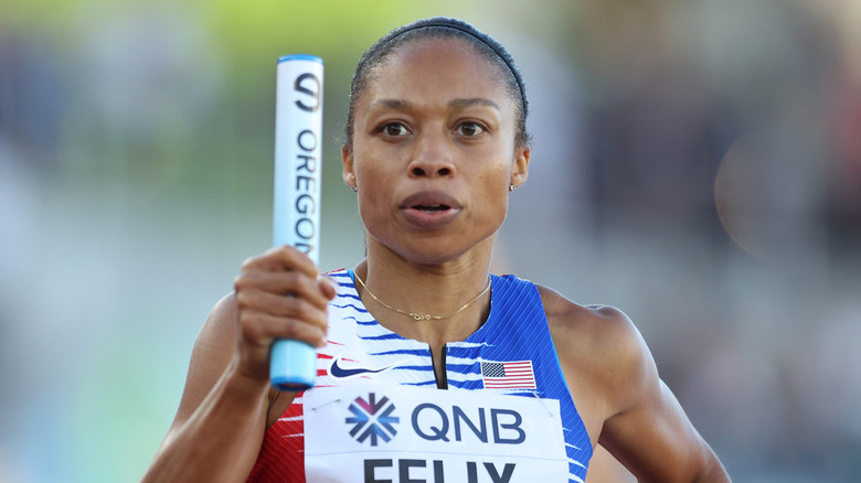 Allyson Felix holds baton