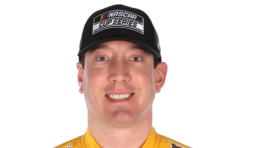 Kyle Busch smiling in NASCAR jumpsuit